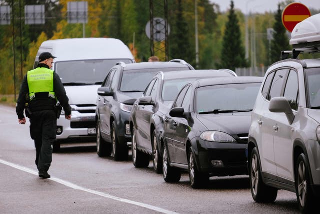 <p>A border guard officer controls the vehicles entering Finland at the border checkpoint crossing in Vaalimaa, Finland, on the border with the Russian Federation </p>