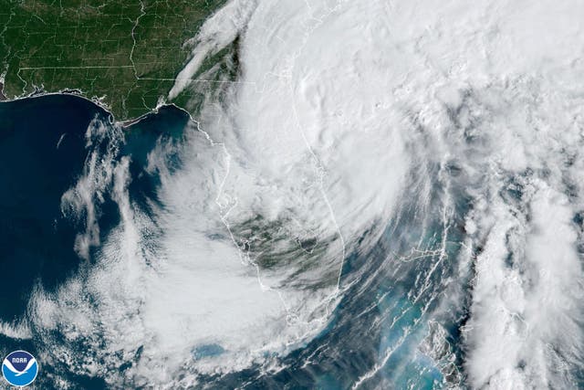 <p>Satellite footage of Tropical Storm Ian as it passes back over the ocean after devastating Florida</p>
