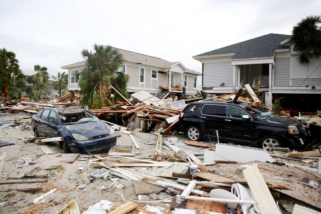 <p>The remains of damaged homes and cars in Fort Myers Beach, Florida on Thursday</p>
