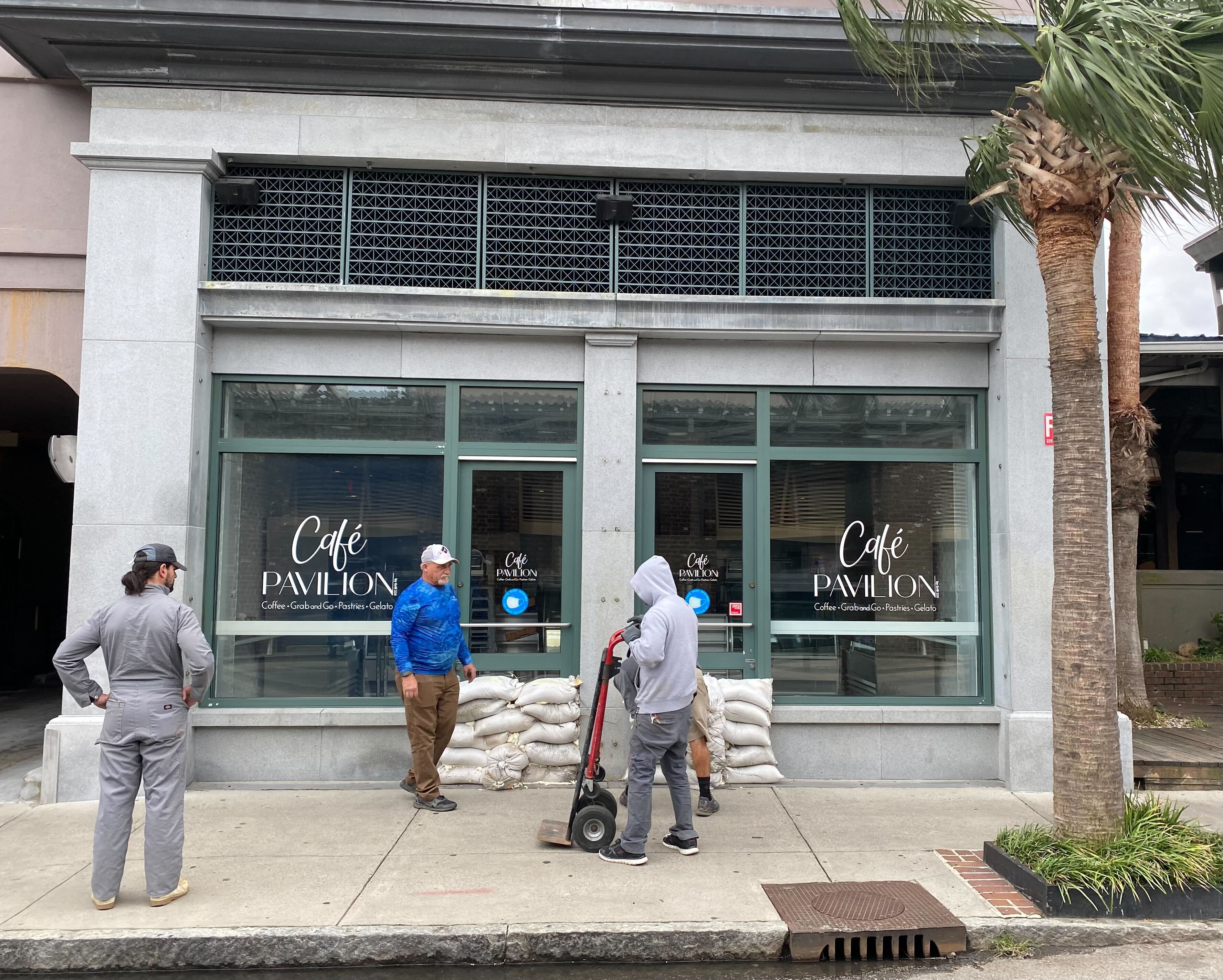 Businesses in Charleston, SC put sandbags in front of their stores on Thursday to prepare for Hurricane Ian