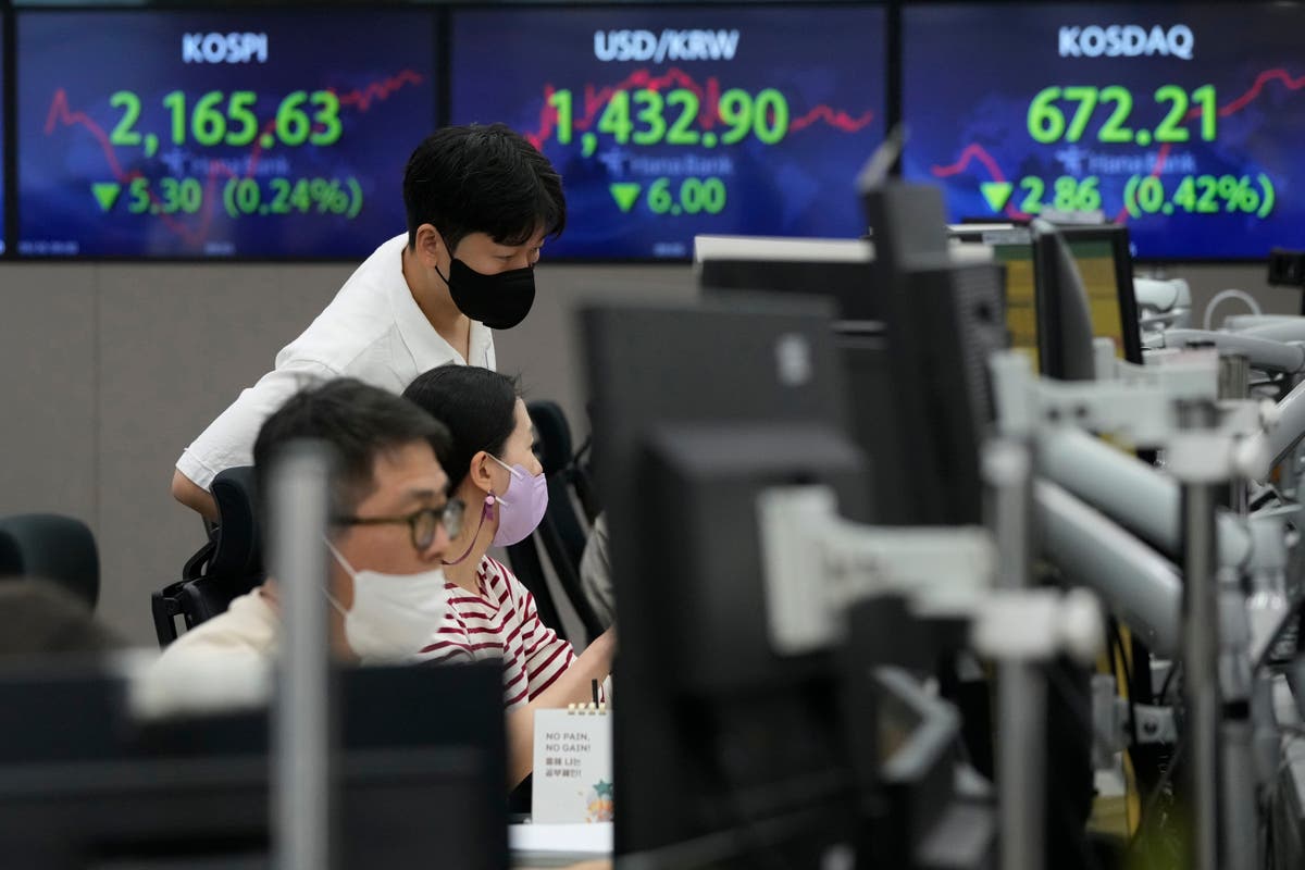 Asian stocks sink on German inflation, British tax cuts
