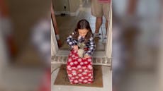 Young girl bursts into tears as she unwraps puppy for Christmas