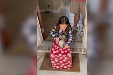 Young girl bursts into tears as she unwraps puppy for Christmas