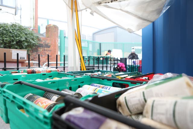 Food laid out in crates at a food bank in north London (Luciana Guerra/PA)