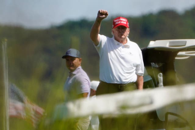 <p>Former president Donald Trump golfing in Virginia</p>