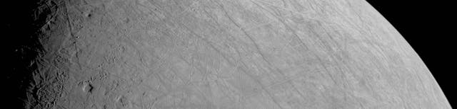 <p>The icy and grooved surface of Jupiter’s moon Europa as seen by Nasa’s Juno probe on 29 September, 2022</p>