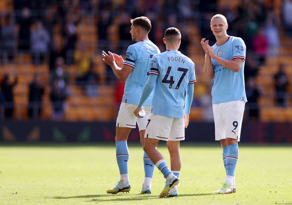 Manchester City’s Erling Haaland, right, and teammates