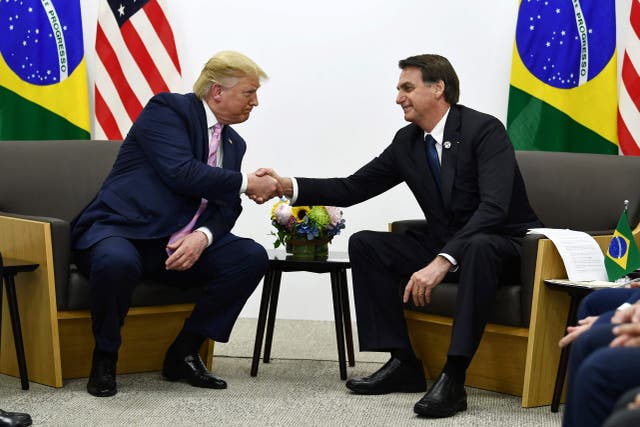 <p>Donald Trump and Jair Bolsonaro meet at a G20 summit in Osaka, Japan, in June 2019 </p>