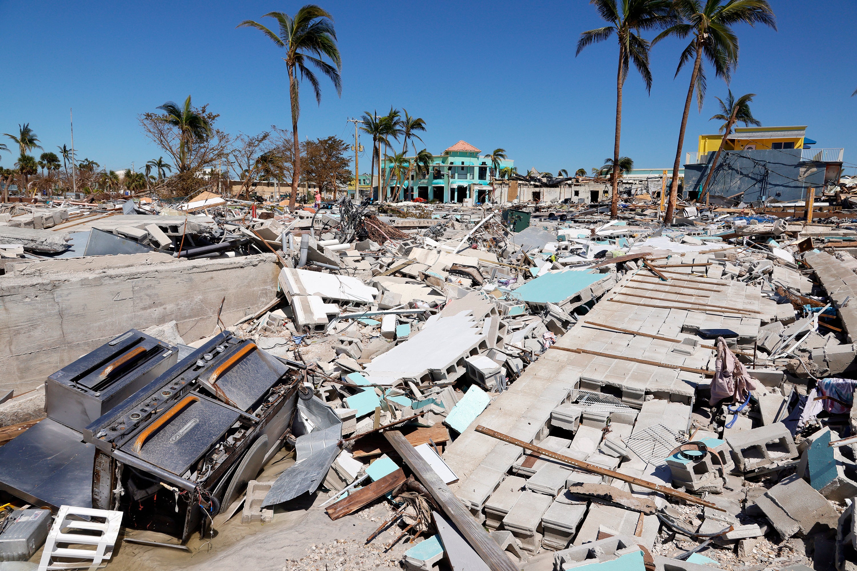 The Times Square area near the Lynn Hall Pier has been reduced to rubble on the island of Fort Myers Beach, Florida