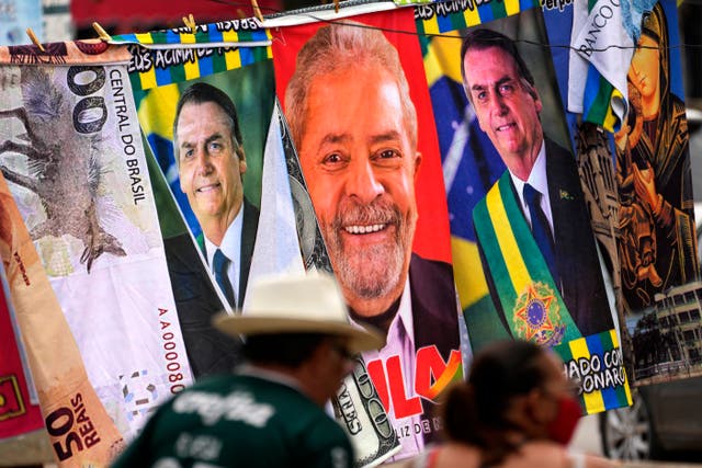 <p>Banners with the faces of Jair Bolsonaro and Luiz Inacio Lula da Silva </p>