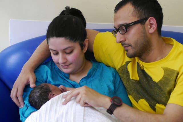 Sanam Saleh and husband Abu with their son Idrees who died aged five days after being born with Hypoplastic Left Heart Syndrome (Sanam Saleh/BHF/PA)