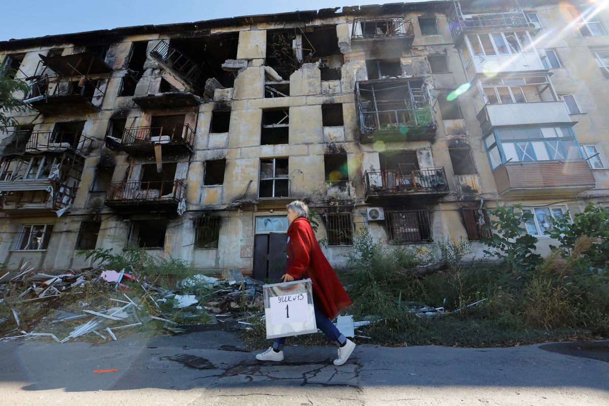 ‘With God’s help, we will go back’: Ukrainians flee annexed regions as Putin declares them Russian