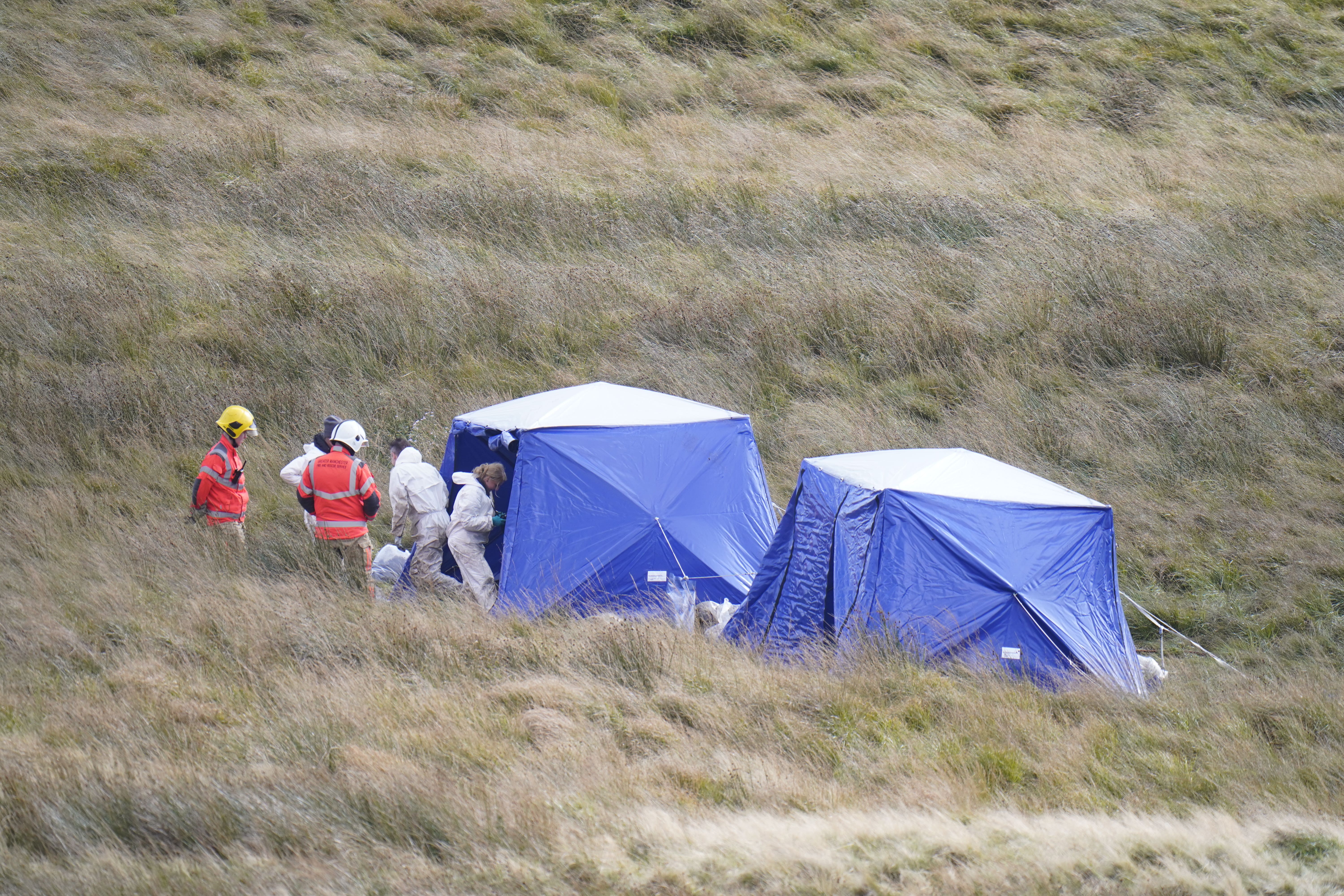 Police officers and firefighters on Saddleworth Moor