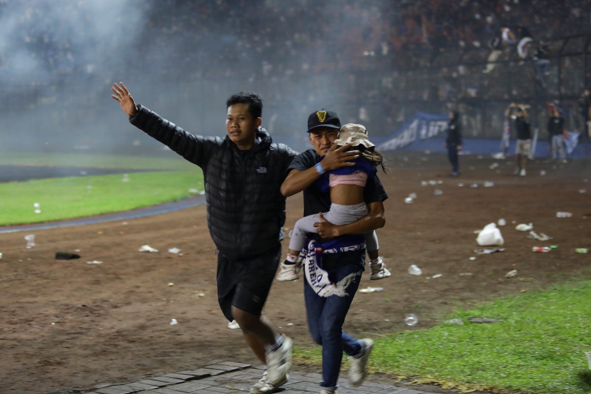 Indonesia football riot: 174 dead and nearly 200 injured after stampede in east Java stadium