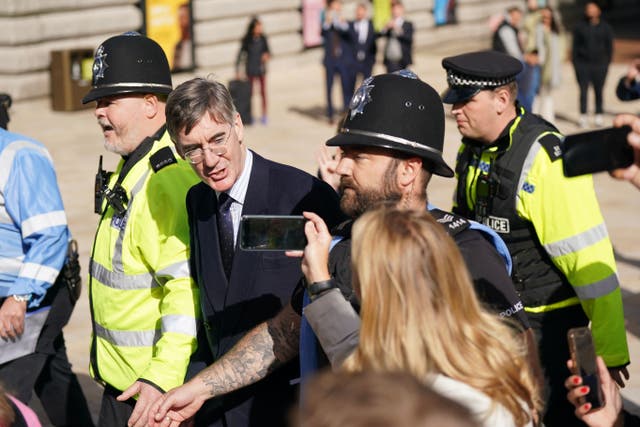 Business Secretary Jacob Rees-Mogg was chased and heckled by protesters in Birmingham (Jacob King/PA)