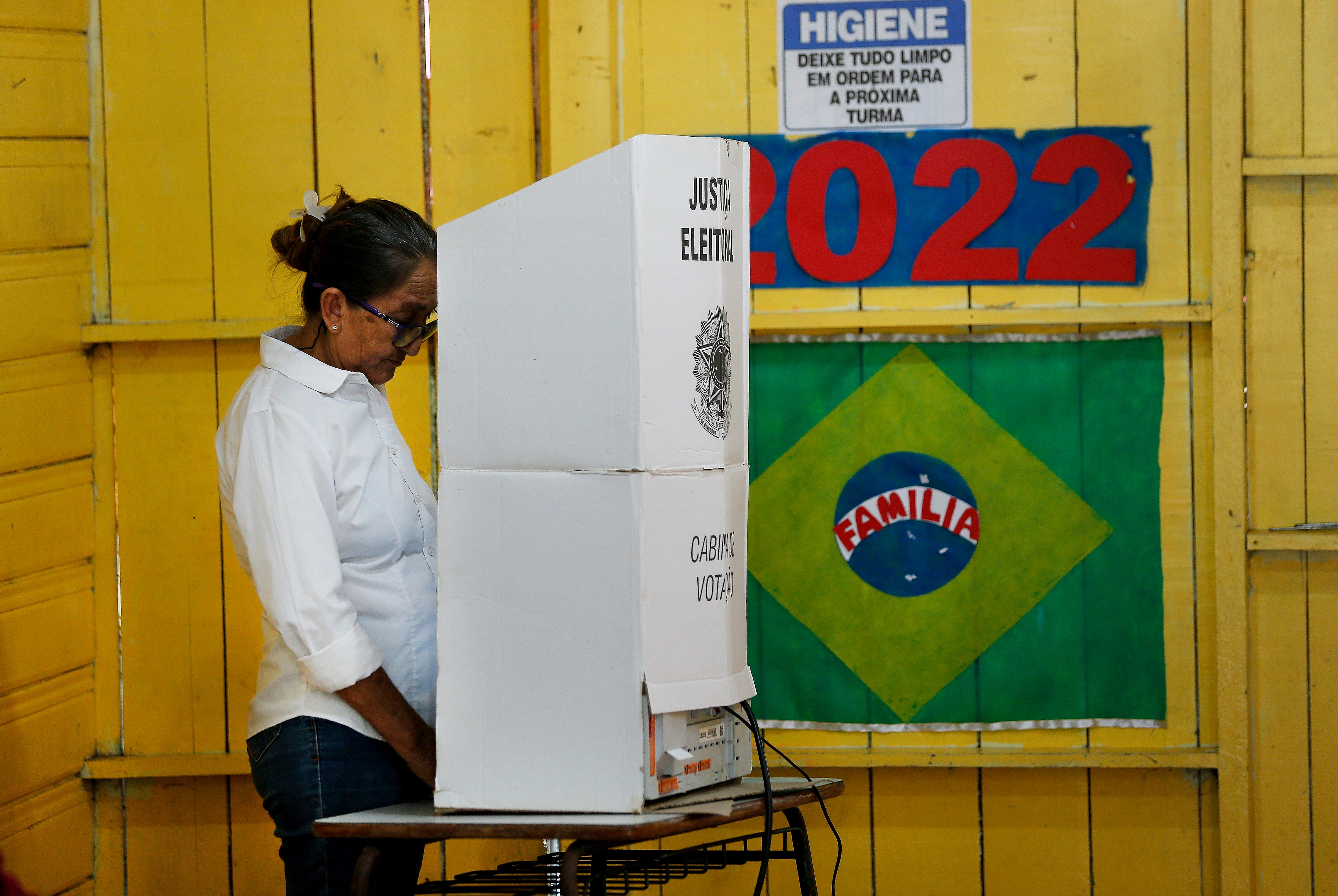 A woman votes at a polling station, in Lago de Catalao – Amazonas state