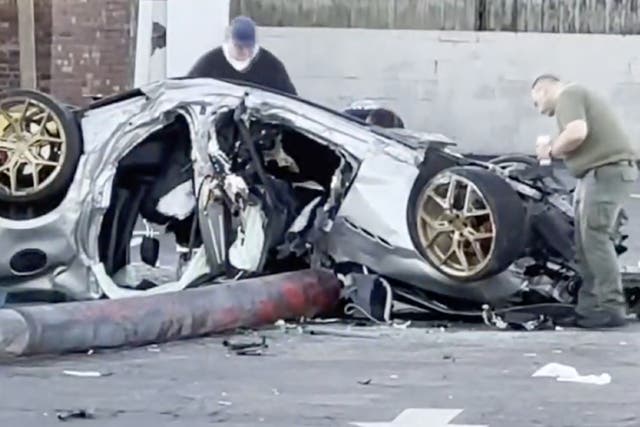<p>Pinellas County officials examine the wreckage of a Maserati that had been allegedly stolen by a group of teens. The teens allegedly crashed the vehicle, killing one and seriously injuring the others</p>