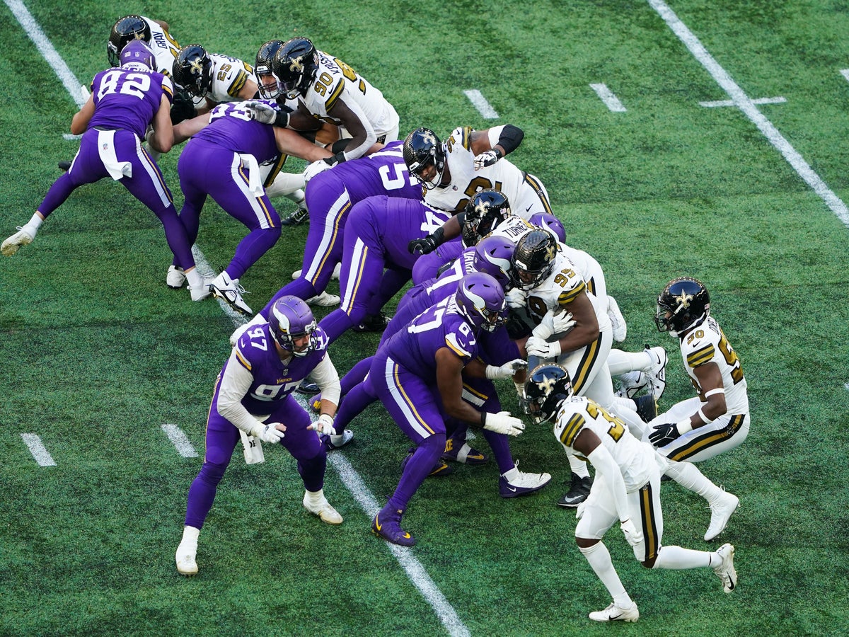 LONDON, UNITED KINGDOM. 02th, Oct 2022. Adam Thielen of Minnesota Vikings  (left) is tackled by Paulson Adebo of New Orleans Saints (right) during NFL  2022 London Series - Minnesota Vikings vs New