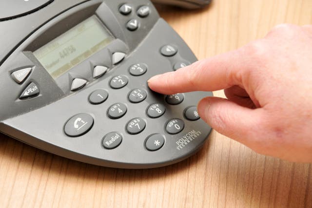 A phone being dialled (Lewis Stickley/PA)