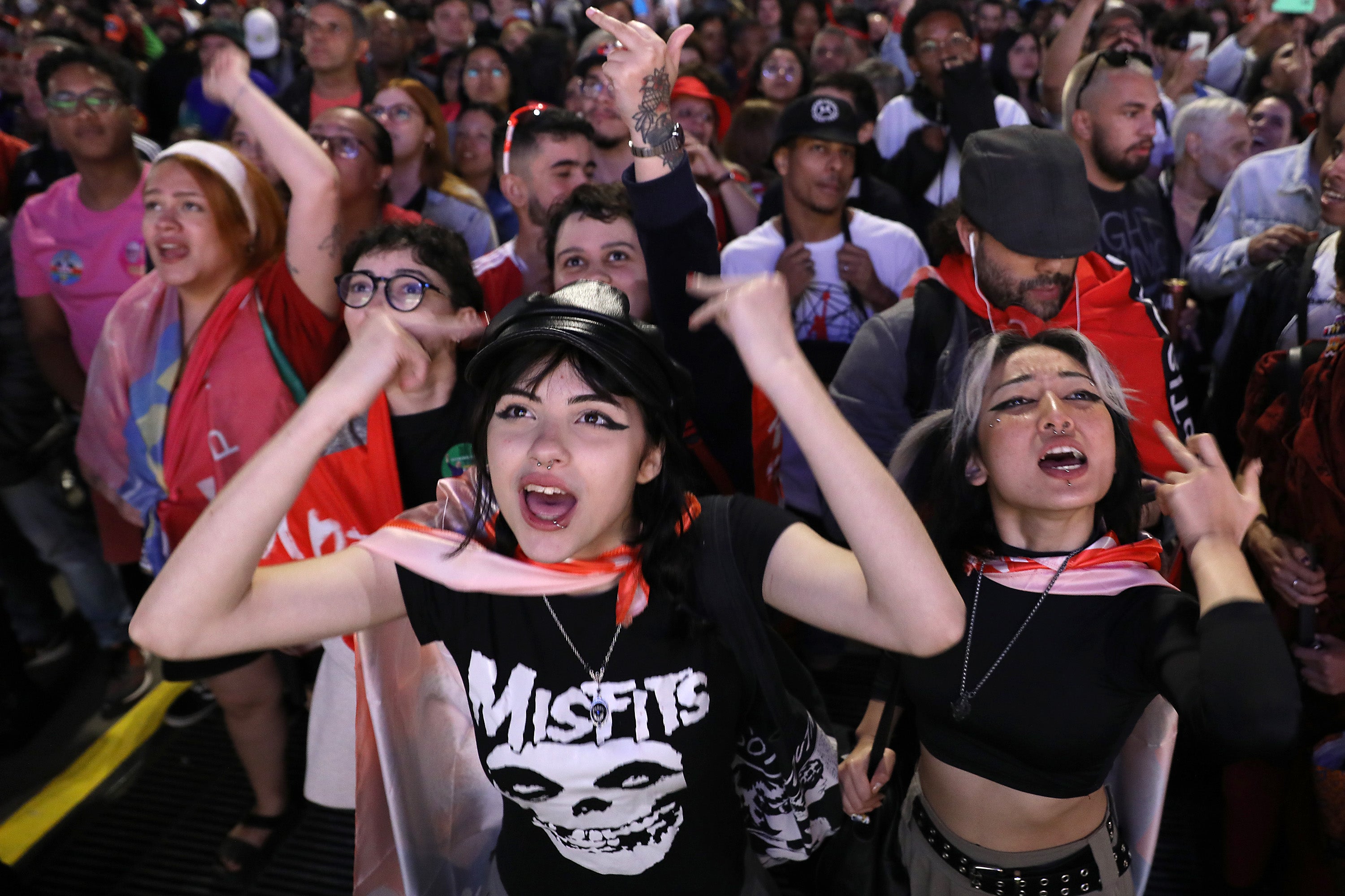 Supporters of former president Luiz Inacio Lula da Silva shout slogans as waiting for results at the end of the general election day