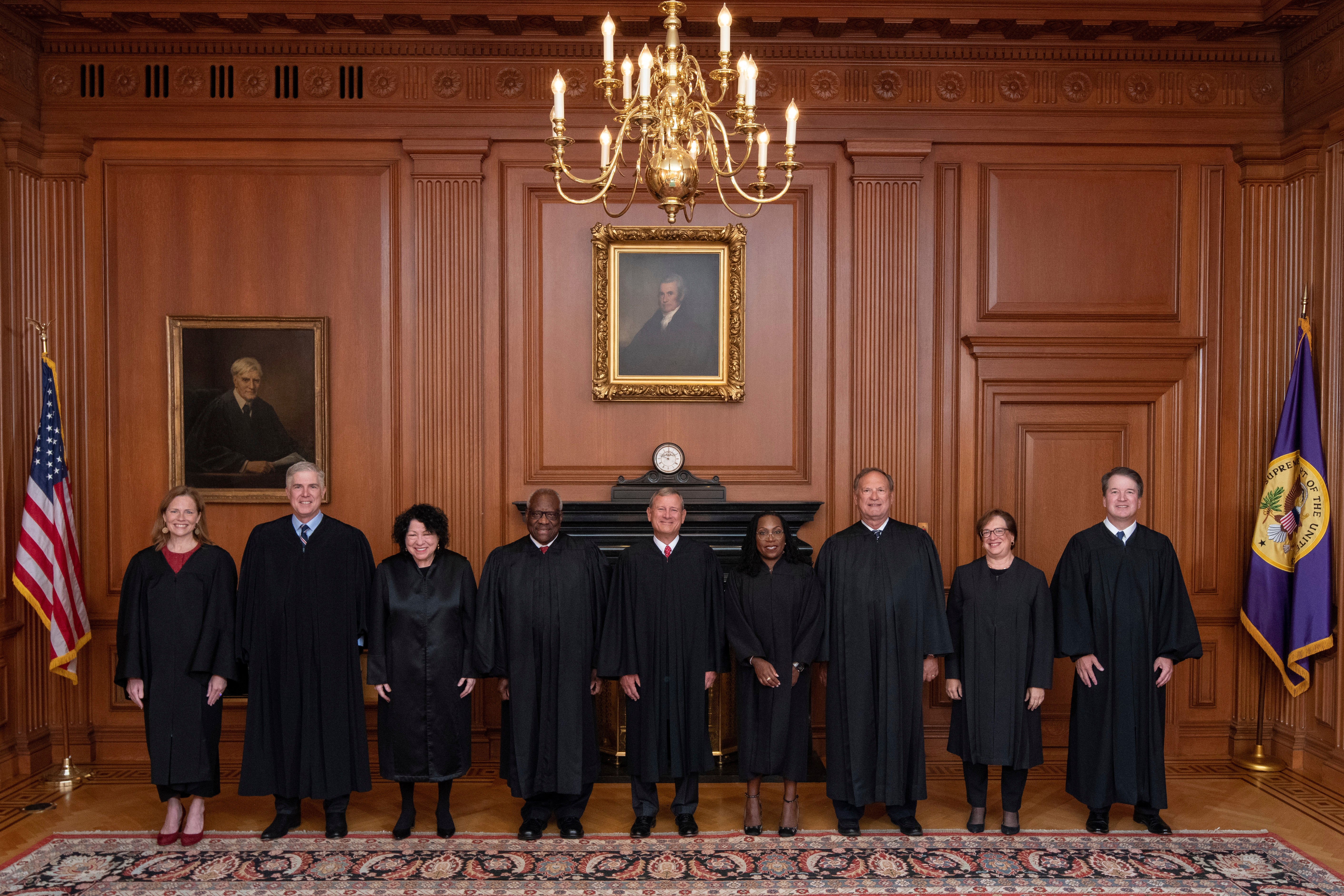 Members of the Supreme Court pose for a photo during Associate Justice Ketanji Brown Jackson's formal investiture ceremony at the Supreme Court in Washington on 30 September