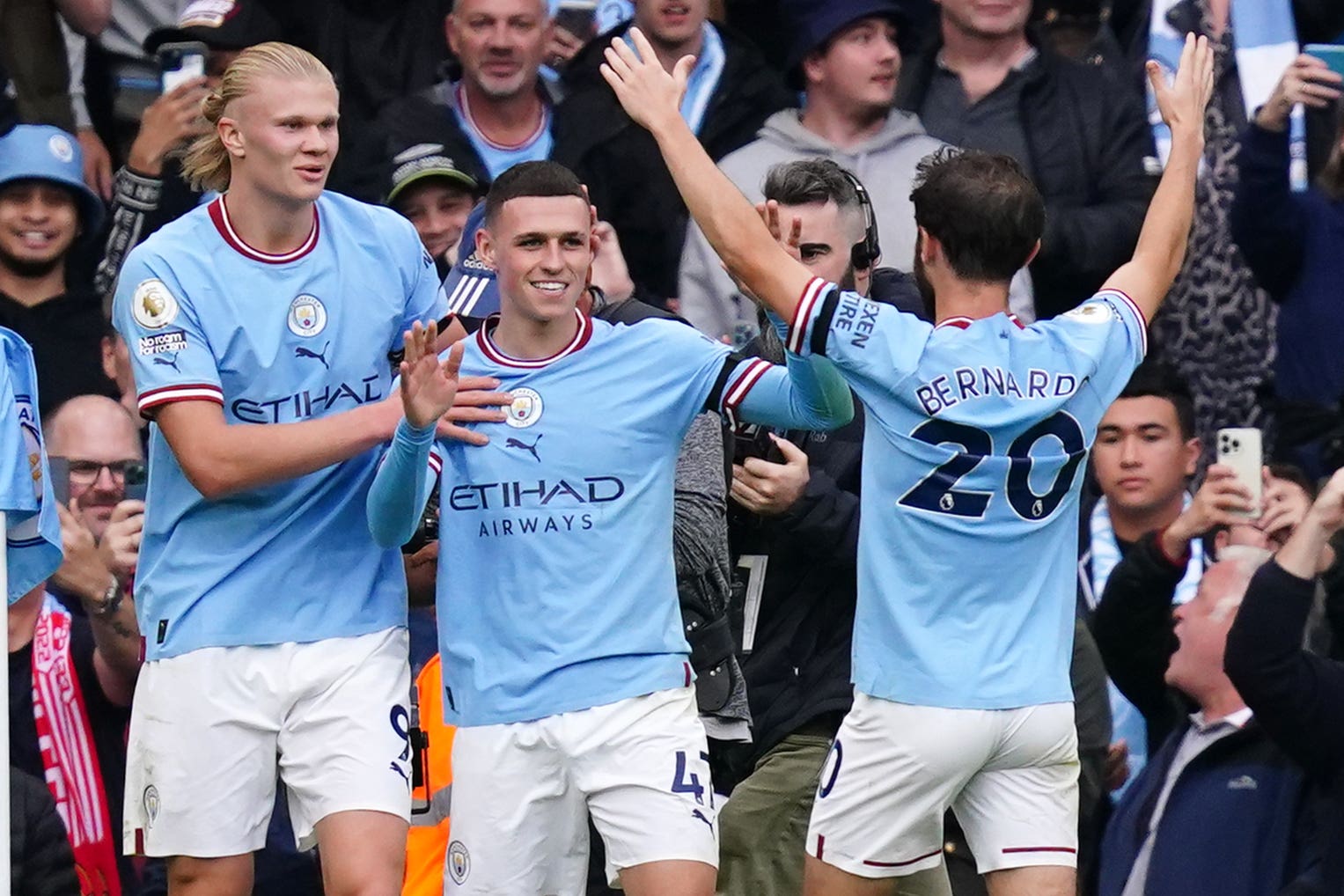 Erling Haaland, left, and Phil Foden, centre, scored hat-tricks for Manchester City (Martin Rickett/PA)