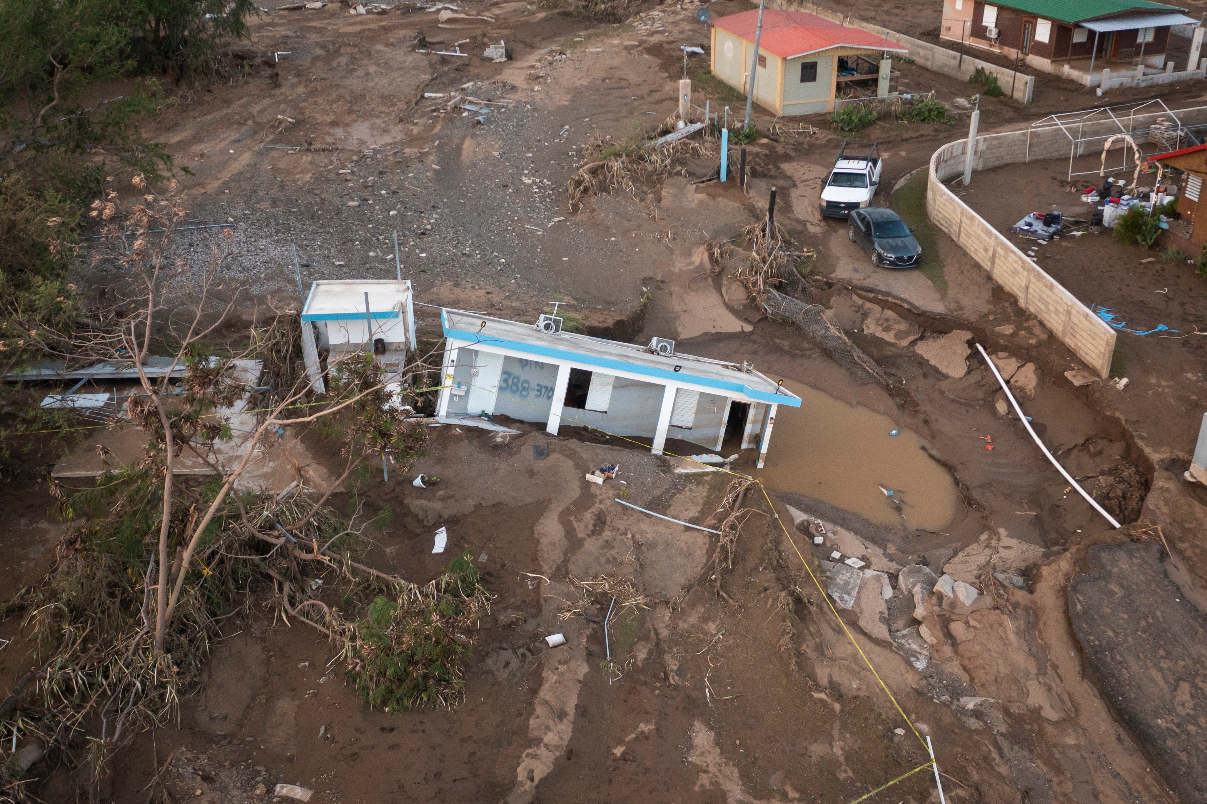 A house lies in the mud after it was washed away by Hurricane Fiona in Salinas, Puerto Rico, on 21 September 2022