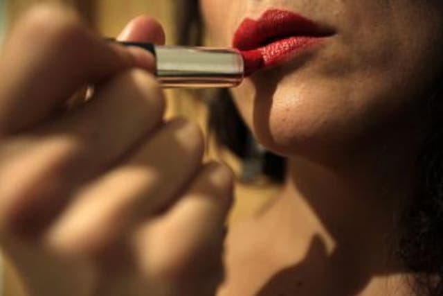 <p>Representational image: Woman using using lipstick</p>