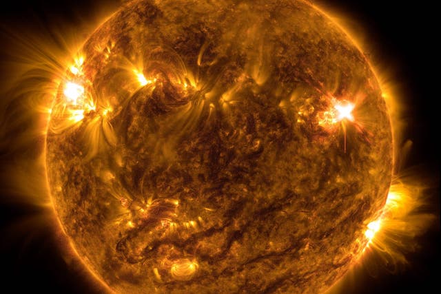 <p>NASA’s Solar Dynamics Observatory captured this image of a solar flare – as seen in the bright flash on the top right – on Oct. 2, 2022. The image shows a subset of extreme ultraviolet light that highlights the extremely hot material in flares and which is colorized in orange</p>