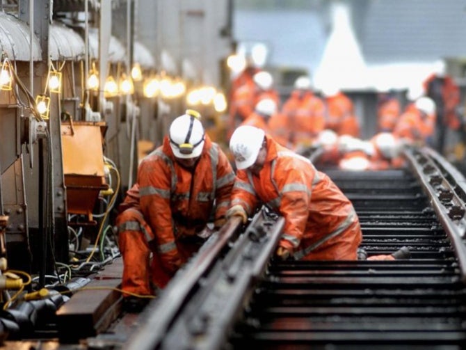 Train strain: Network Rail engineers carry out maintenance on a bridge