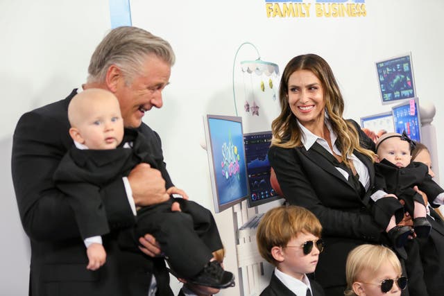 <p>Alec and Hilaria Baldwin with six of their children in June 2021</p>