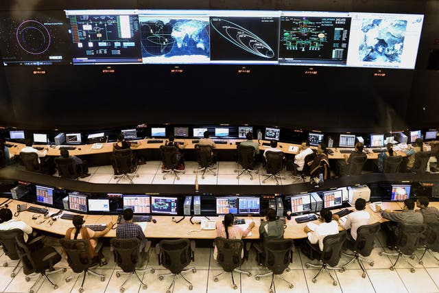 <p>Indian scientists and engineers of the Indian Space Research Organisation (ISRO) monitor the Mars Orbiter Mission (MOM) at the tracking centre in Bangalore on 27 November 2013</p>