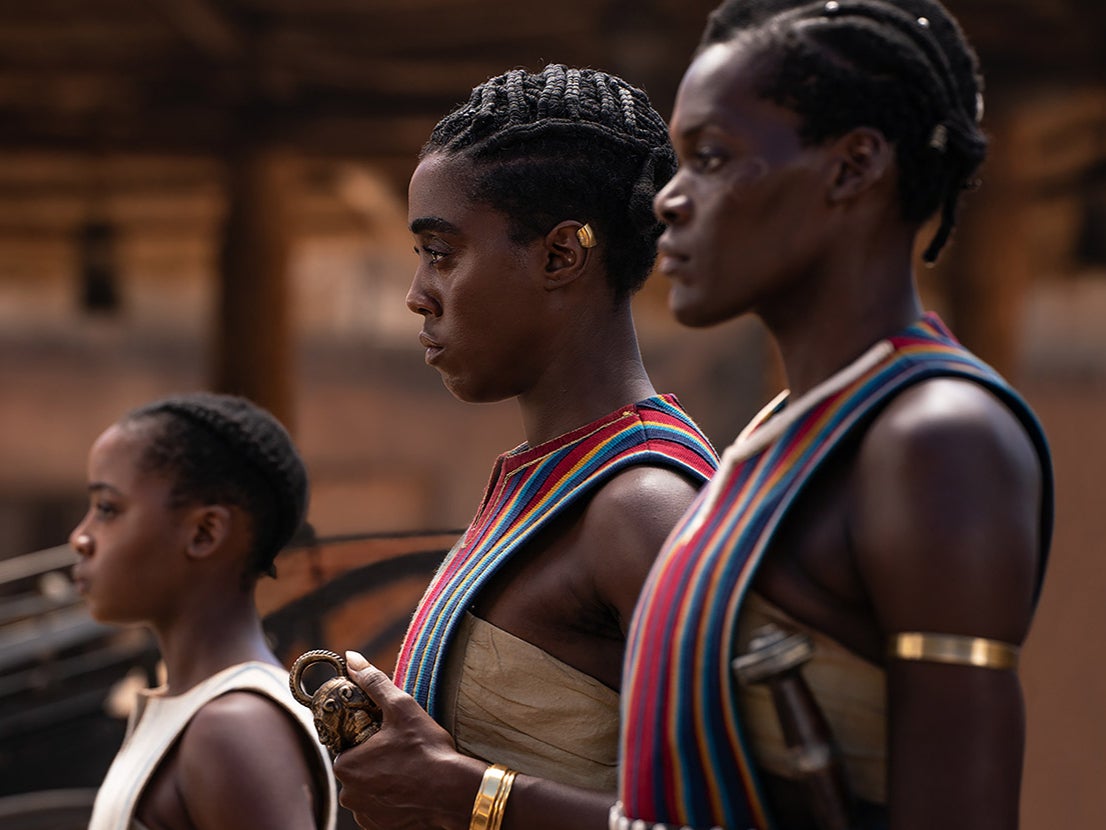 Atim (right) plays one of the many members of the Agojie, the all-women fighting force of Dahomey