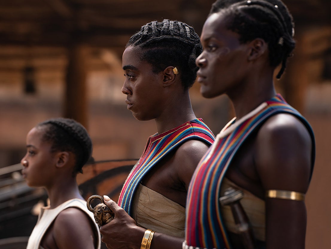 Atim (right) plays one of the many members of the Agojie, the all-women fighting force of Dahomey