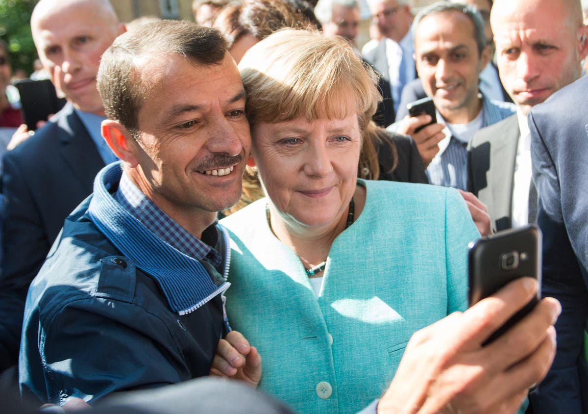 Merkel wins UN refugee agency award over welcome of Syrians