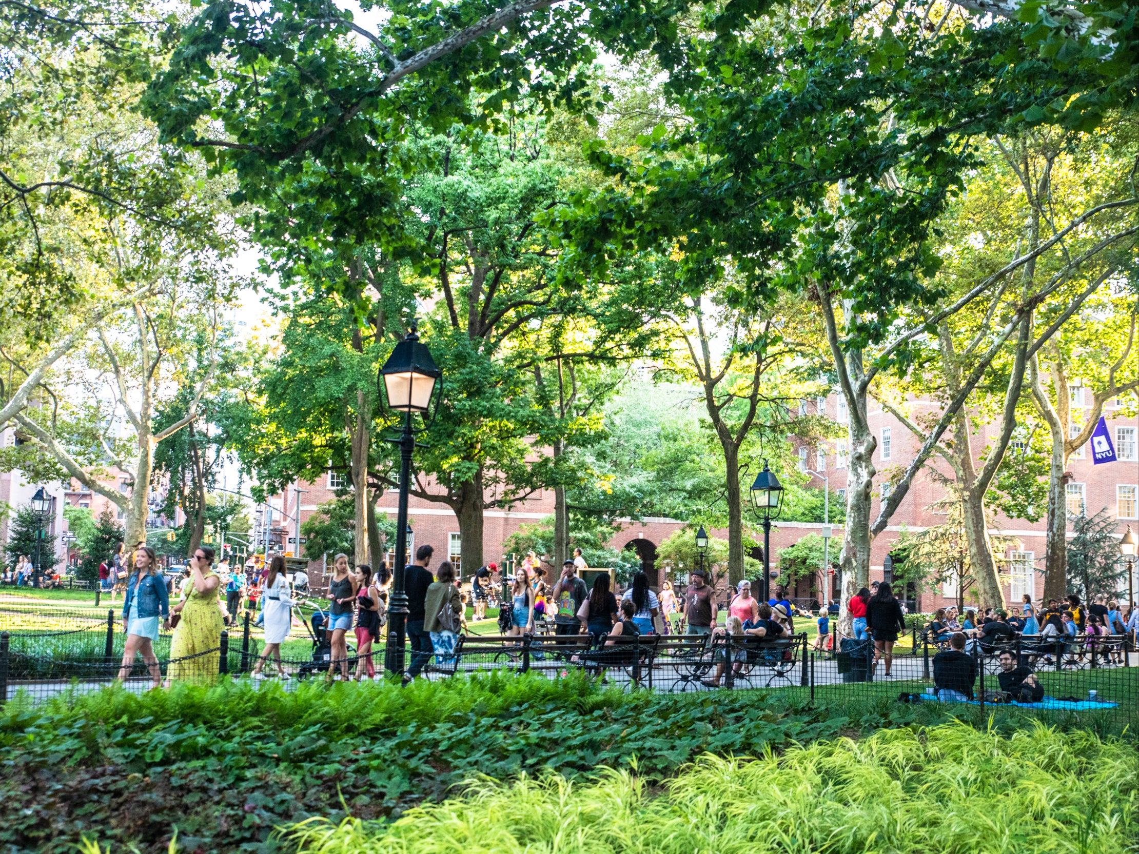 New York University students walk through Manhattan’s Washington Square Park in Greenwich Village