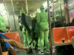 Six women in green jumpsuits robbed and beat two women on the NYC Subway