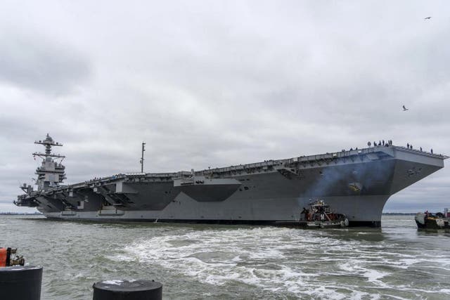 <p>This handout photo provided by the US Navy shows the USS Gerald R. Ford-class aircraft carrier USS Gerald R. Ford (CVN 78) departing Naval Station Norfolk, Virginia on October 4, 2022</p>
