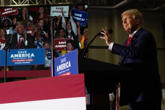 <p>Former president Donald Trump speaks during a Save America rally on 1 October 2022 in Warren, Michigan</p>
