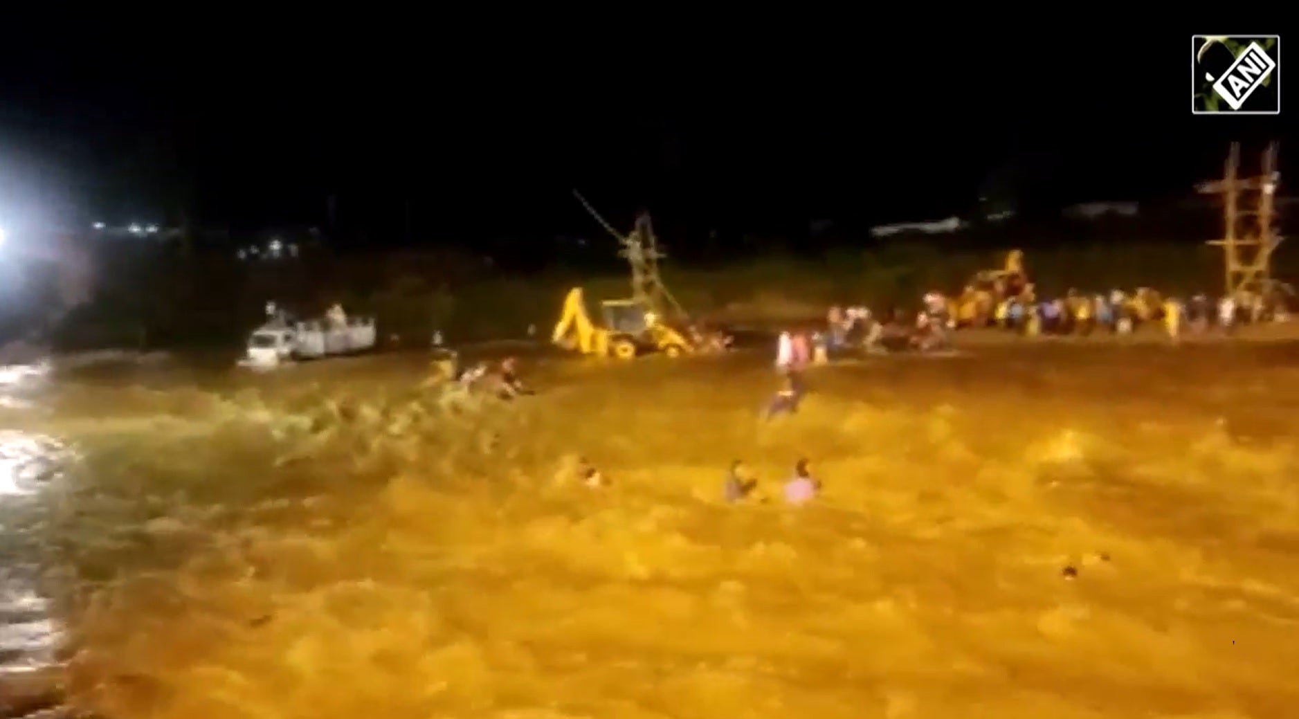Screengrab from a video showing people being swept away during a flash flood in West Bengal on Wednesday, 5 October 2022