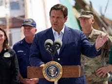 Photo of Gov Ron DeSantis behind presidential seal in Florida goes viral