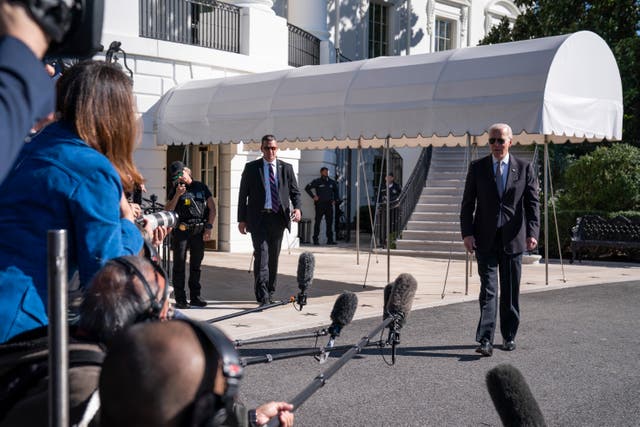 <p>President Joe Biden walks over to speak with reporters before boarding Marine One on the South Lawn of the White House, Thursday, Oct. 6, 2022, in Washington. (AP Photo/Evan Vucci)</p>