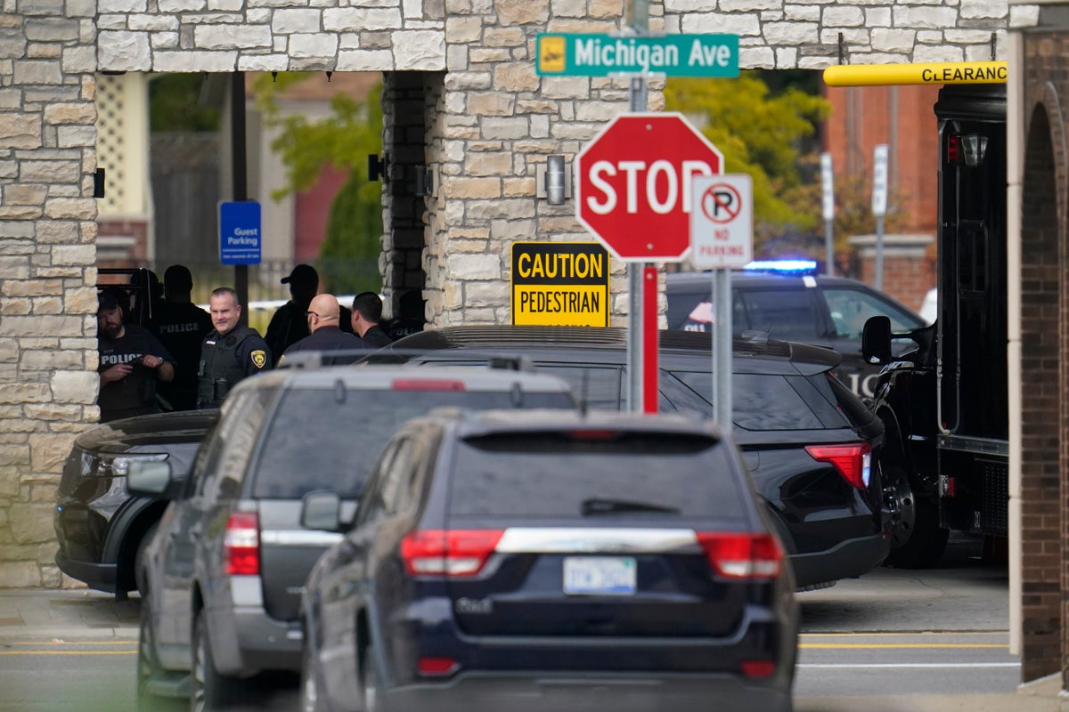 Gunman in fatal Michigan hotel shooting surrenders after police negotiations
