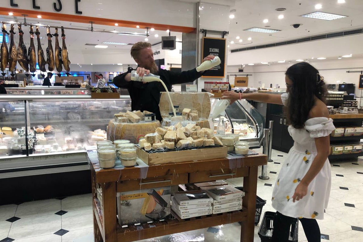 Animal rights protesters douse milk into luxury department stores