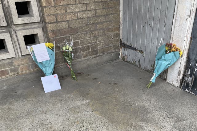 Floral tributes at the scene in Churchill Terrace, Chingford, east London, after 45-year-old James Markham was stabbed to death (Laura Parnaby/PA)