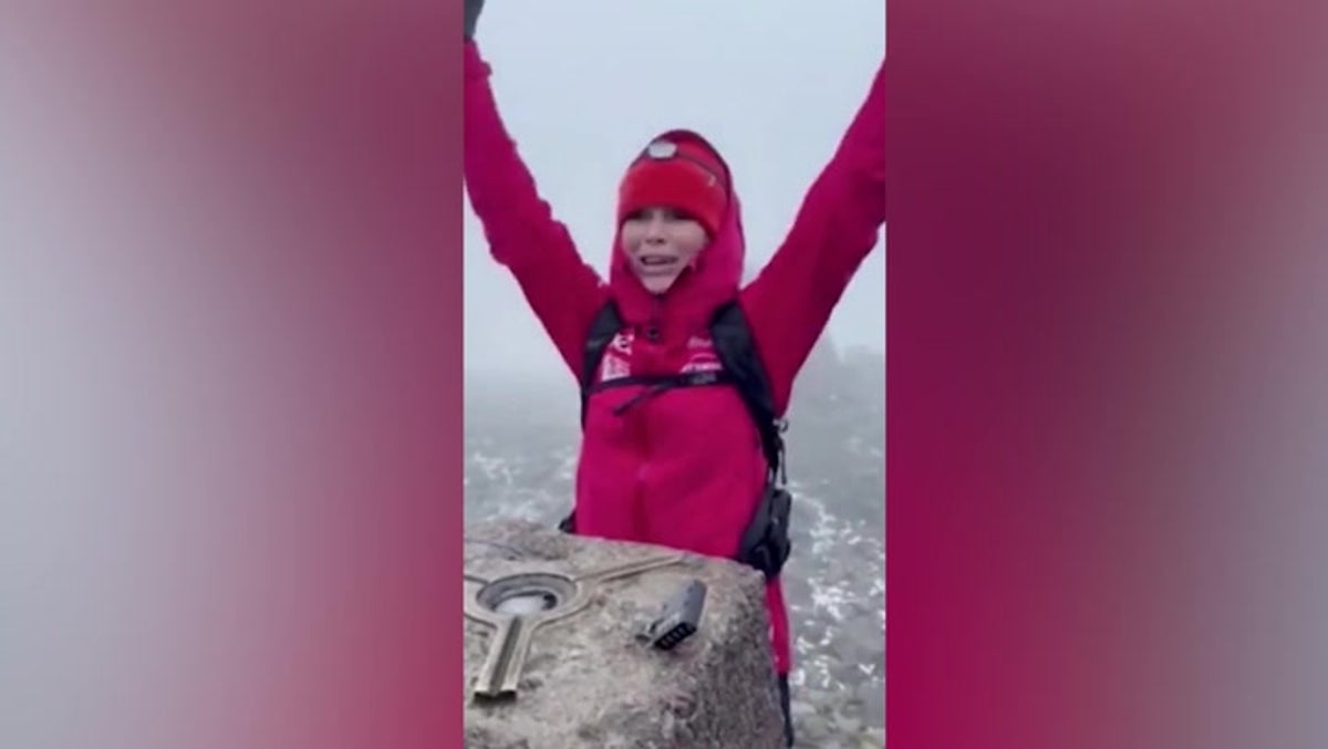Amanda Holden pops champagne on top of UK’s highest mountain Ben Nevis
