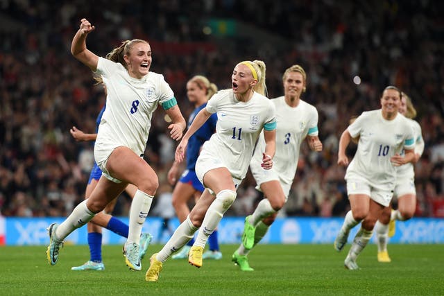 <p>Georgia Stanway celebrates after restoring England’s lead from the spot</p>