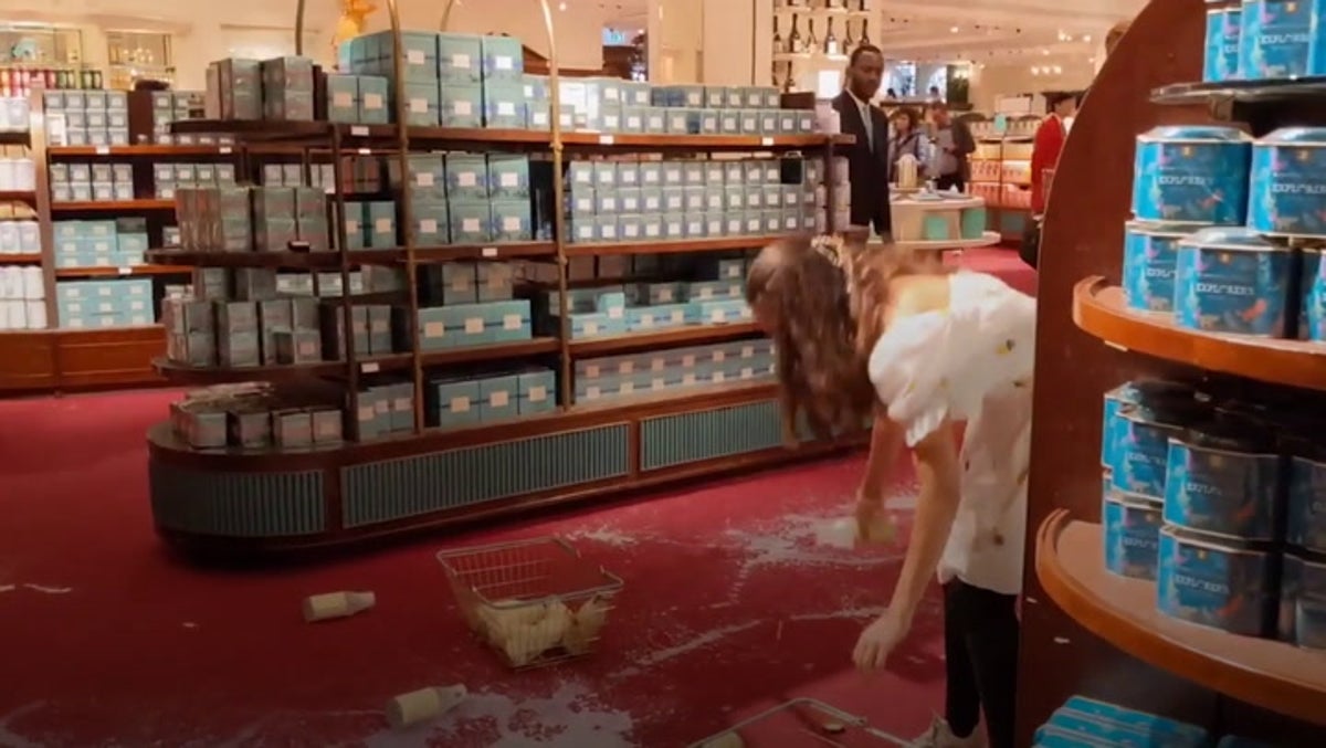 Animal Rebellion protesters pour milk over high-end London department stores