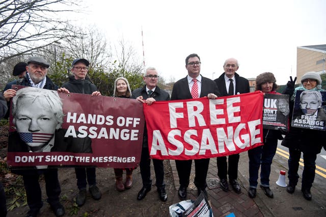 Thousands of people will form a human chain around Parliament on Saturday for the release of Julian Assange (Victoria Jones/PA)