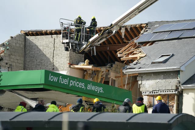 Emergency services continue their work at the scene of an explosion at Applegreen service station in the village of Creeslough (Brian Lawless/PA)